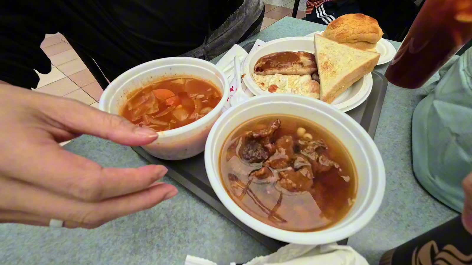 A Hong Kong food court breakfast at KLN Cafe: tomato soup macaroni, satay beef macaroni, and a pork chop with egg and toast