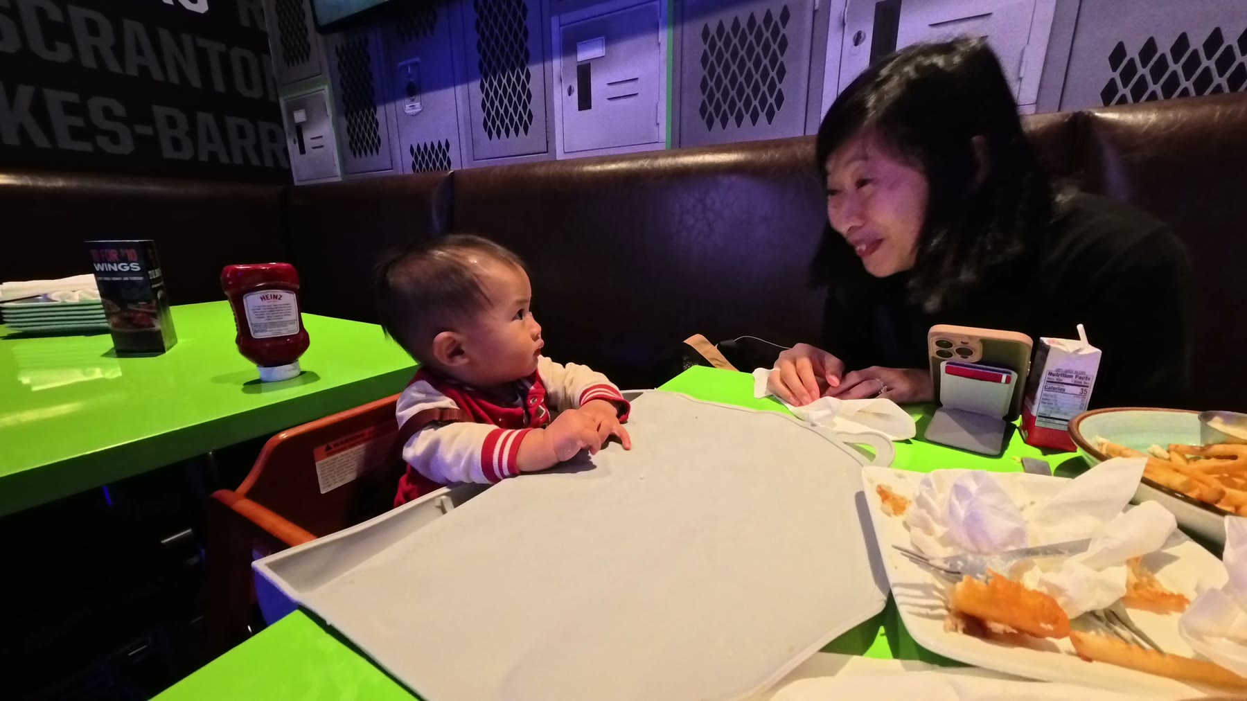 Rina and Archie at a restaurant table