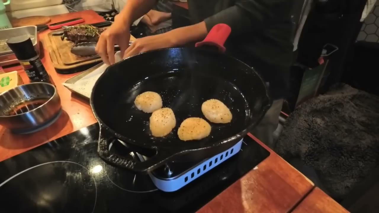 Searing steak in a cast iron pan in the van